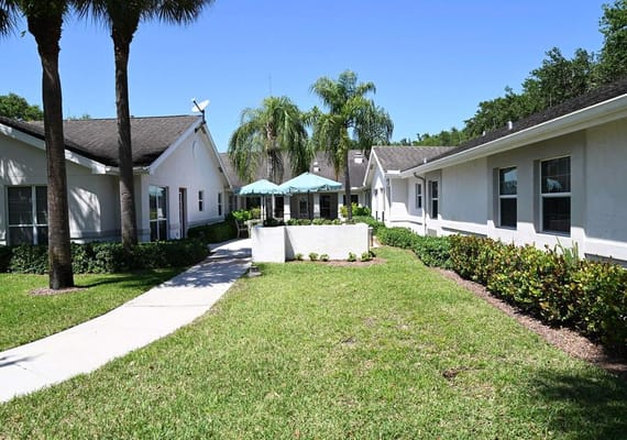 Well-landscaped outdoor area with pathways and shade