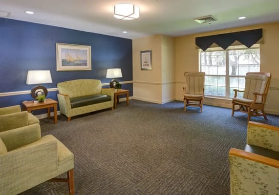 Bright common area with seating and natural light