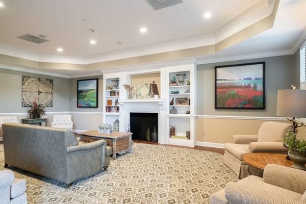 Cozy common area with comfortable seating and art