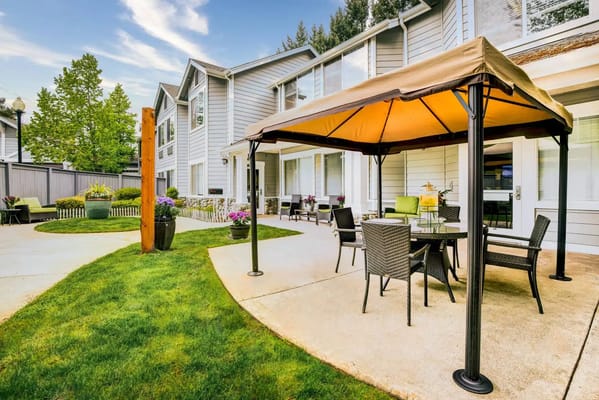 Outdoor seating area in a senior living facility garden