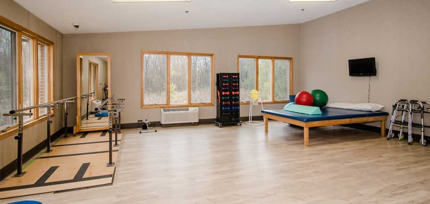 Rehabilitation equipment in a bright activity room