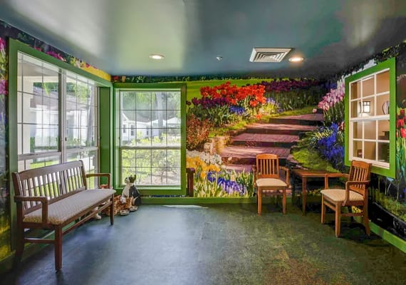 Bright interior space with floral mural and seating