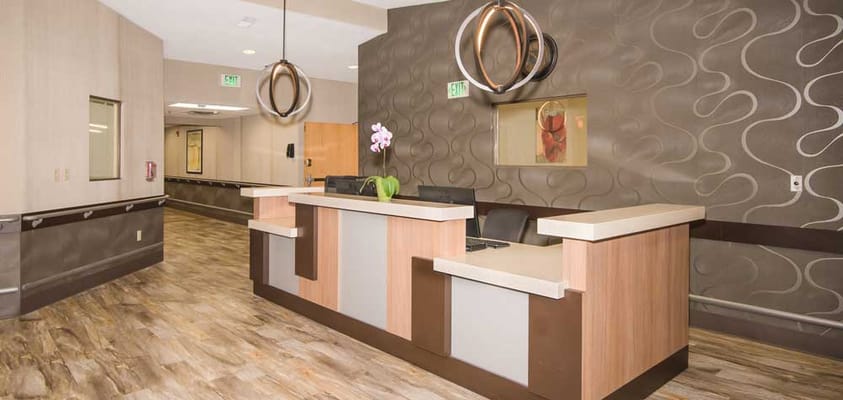 Interior lobby area with a reception desk and elegant decor