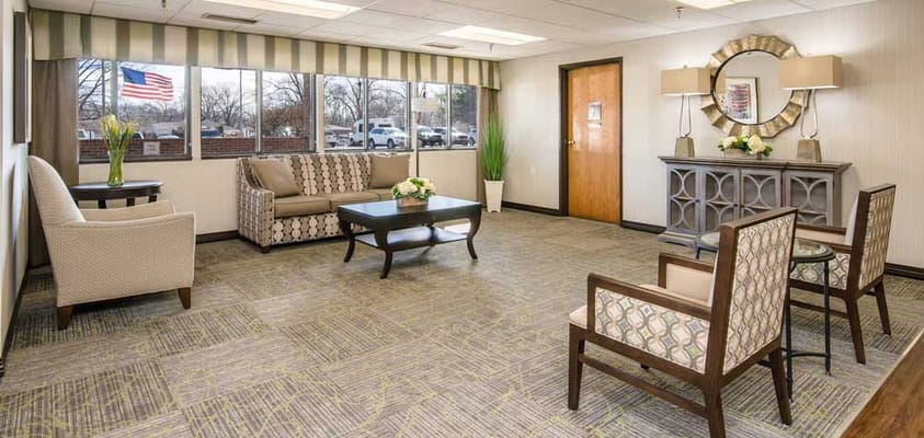 Bright common area with seating and natural light