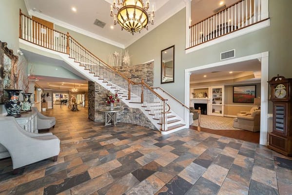 Interior view of a spacious lobby with a staircase