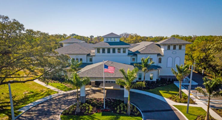 Aerial view of a senior living facility with landscaping