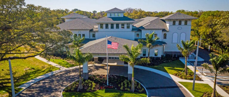 Exterior view of a senior living facility with landscaping