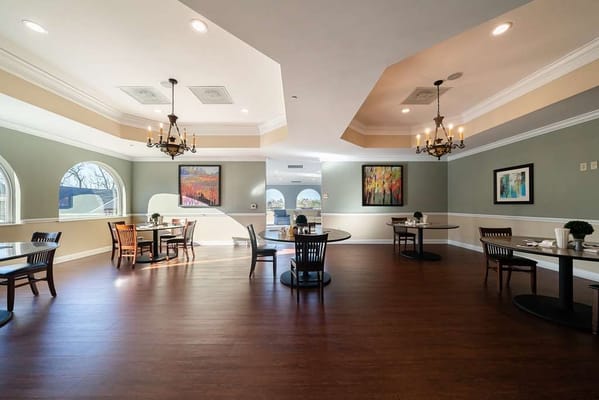 Bright common area with tables and chairs