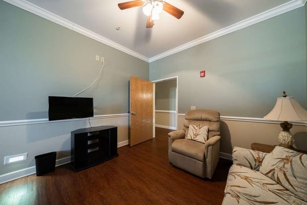 Cozy resident room with furniture and TV