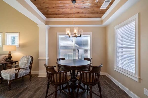 Bright interior setting with a dining table and chairs