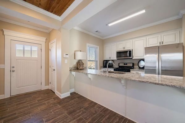 Bright kitchen area with modern appliances