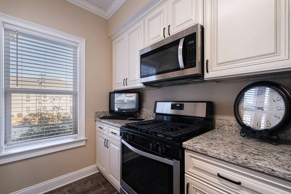 Modern kitchen with stainless steel appliances and natural light