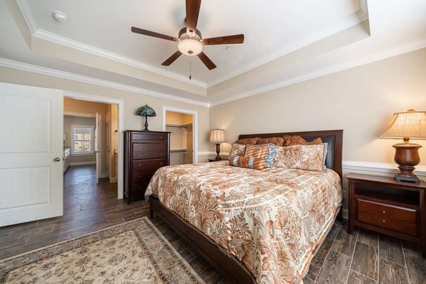 A well-decorated private resident room with a bed and furniture
