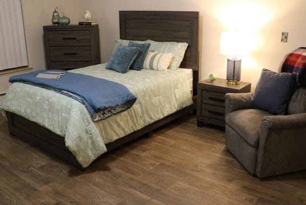 Cozy private resident room with bed and chair