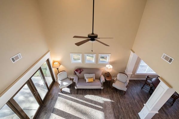 Bright common area with seating and large windows