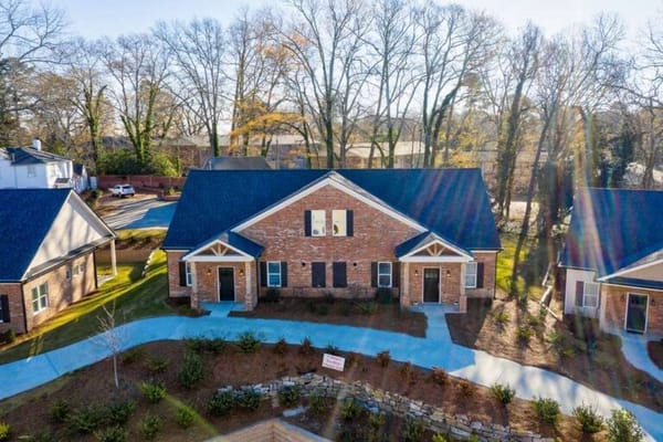 Aerial view of a senior living building with landscaping