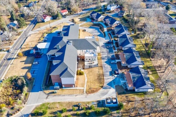 Aerial view of a senior living facility and grounds