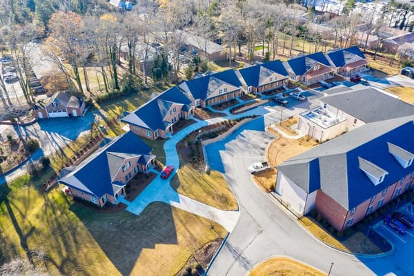 Aerial view of a senior living campus with cottages