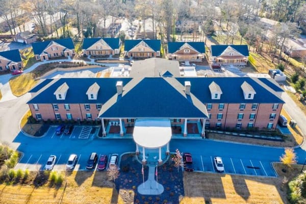 Aerial view of a senior living facility with outdoor space