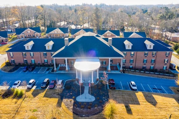 Aerial view of a senior living facility with parking