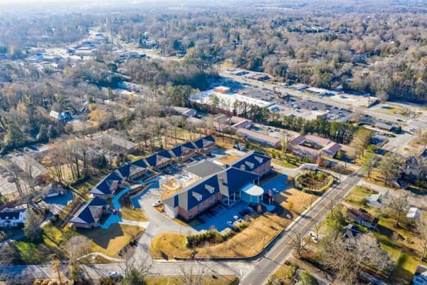 Aerial view of a senior living facility with outdoor space