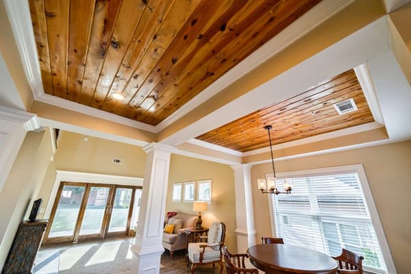Interior view of a cozy living area with wooden ceiling