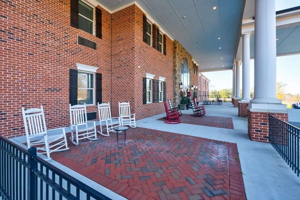 Outdoor seating area with rocking chairs on a patio