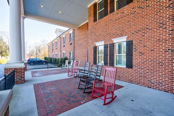 Outdoor seating area with rocking chairs