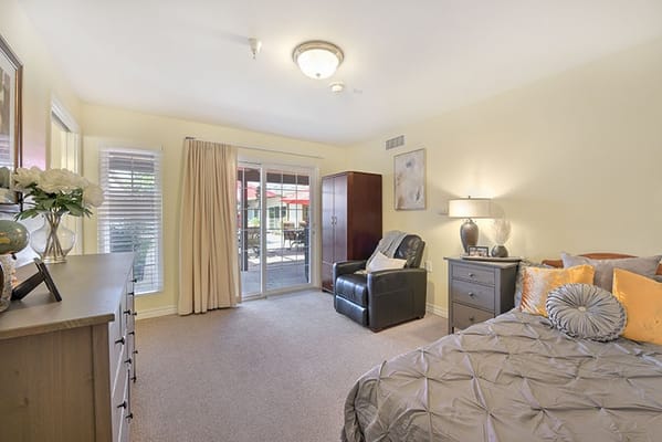 Bright and inviting bedroom with a patio view