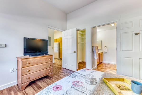 A private resident room featuring furniture and appliances