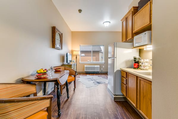 A cozy resident kitchen area with dining table