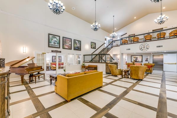Common area with seating and piano in a welcoming lobby