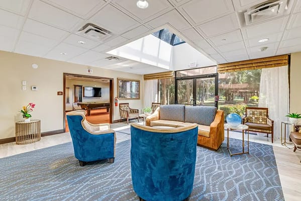 Bright common area with seating and natural light