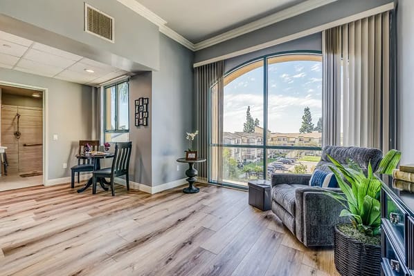 Bright interior common area with seating and windows