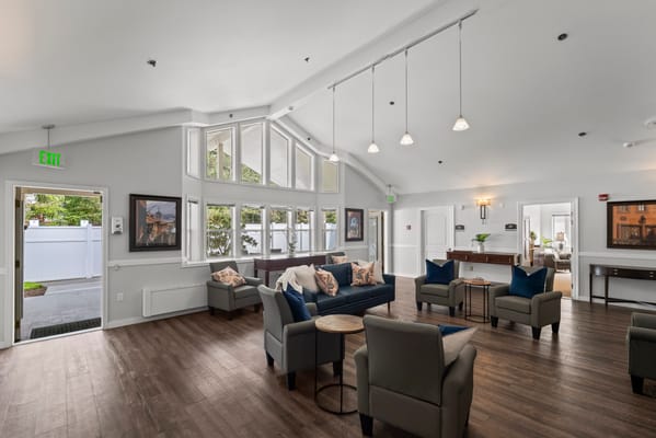 Bright common area with comfy seating and natural light