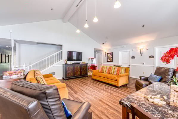 Common area with seating and a television.