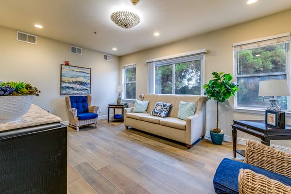 Bright common area with comfortable seating and decor