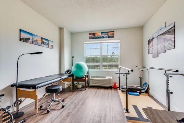 Physical therapy room with exercise equipment