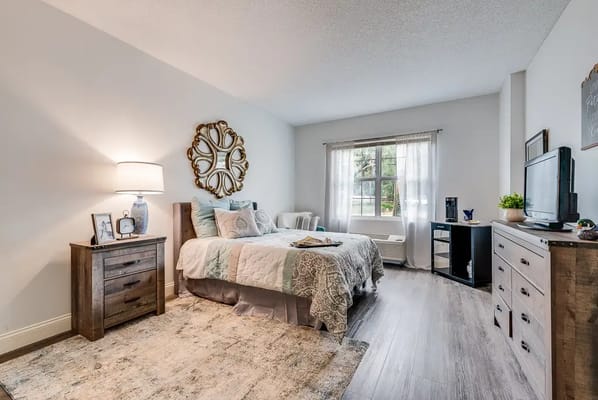 Cozy private resident room with a bed and window