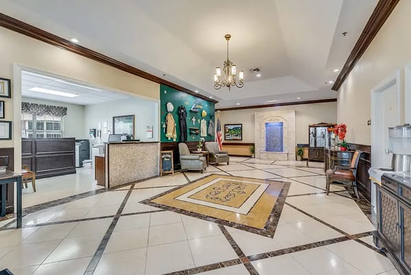 Lobby area with seating and decorative wall
