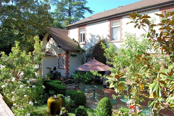Outdoor seating area with garden and patio