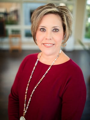 Portrait of a staff member in a warm setting