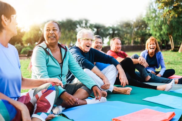 Residents enjoying a yoga class outdoors