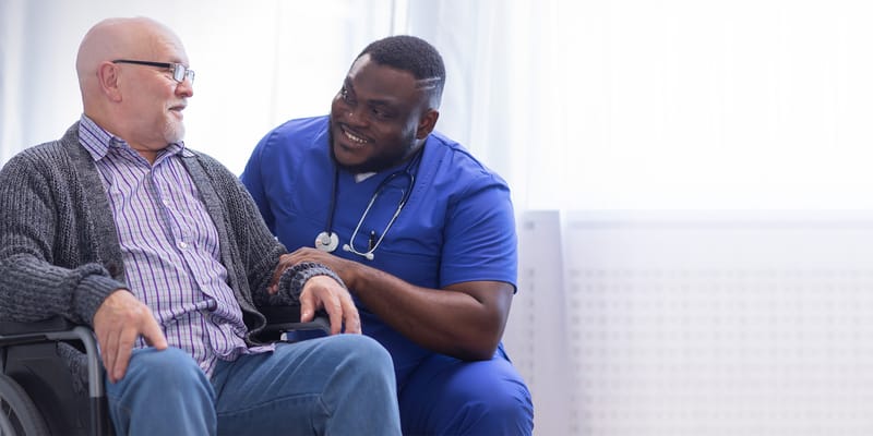 Nurse interacting with resident in a care environment