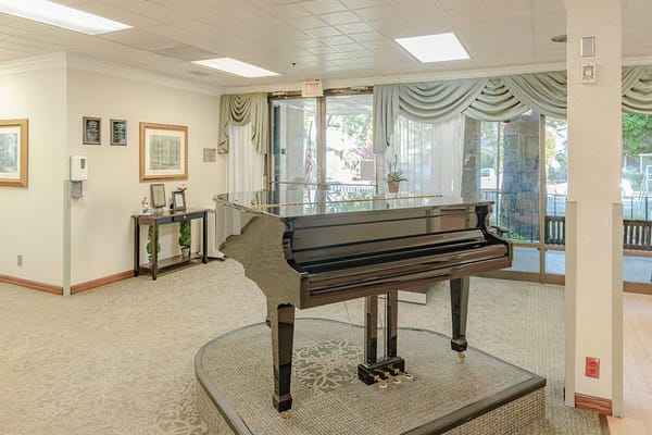 Interior view of a common area with a piano
