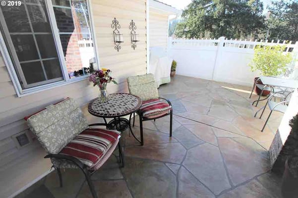 Outdoor patio seating area with flowers