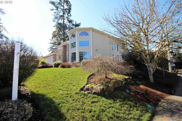 Exterior view of Beaverton Senior Care Home with gardens