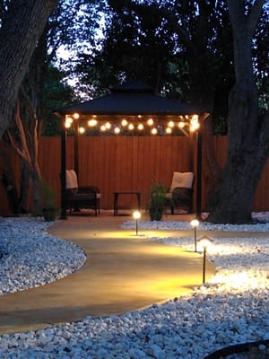 Serene outdoor seating area with decorative lighting