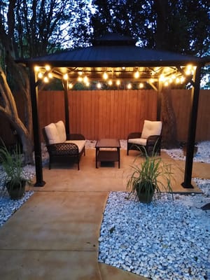 Cozy outdoor space with seating and string lights