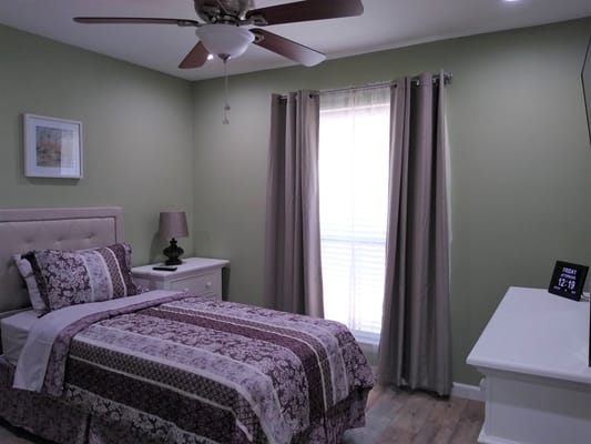 Cozy resident room with a bed and window